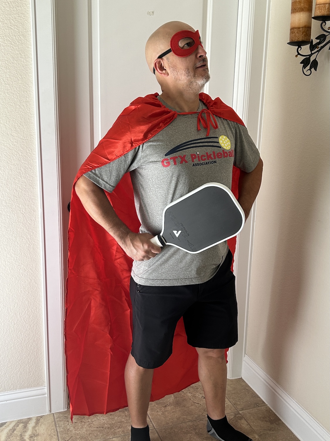 Monico in superhero pickleball costume